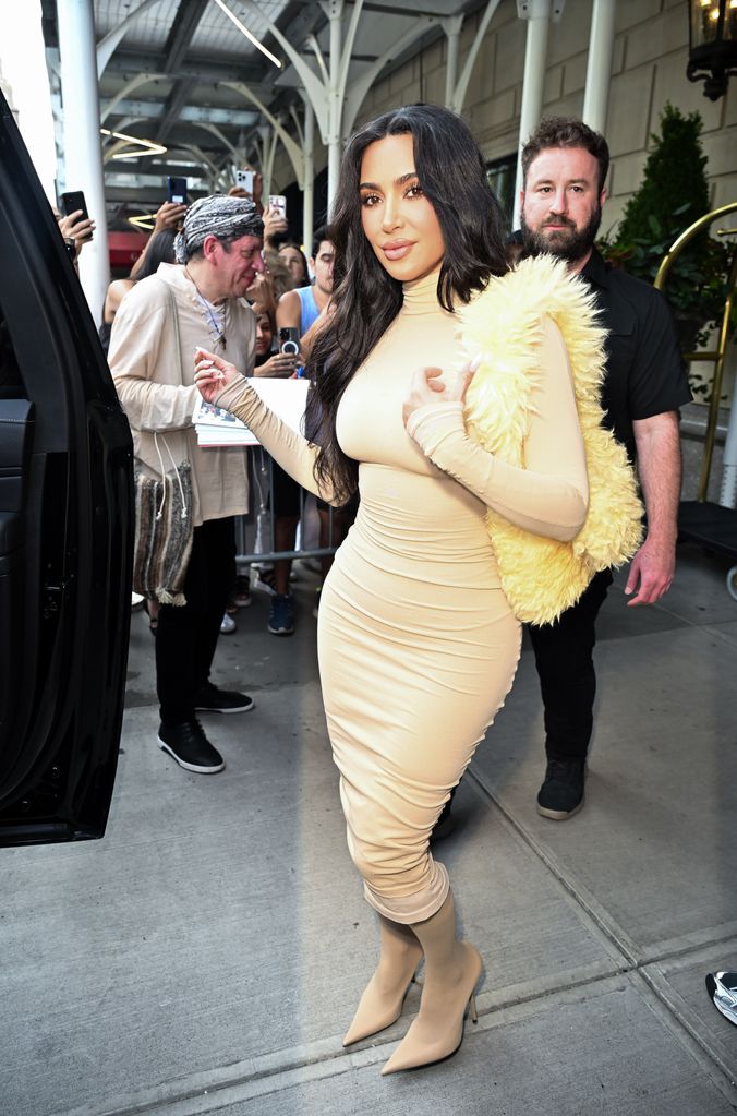 Kim Kardashian s bodycon dress and boots look is giving us major autumn fashion inspo HELLO