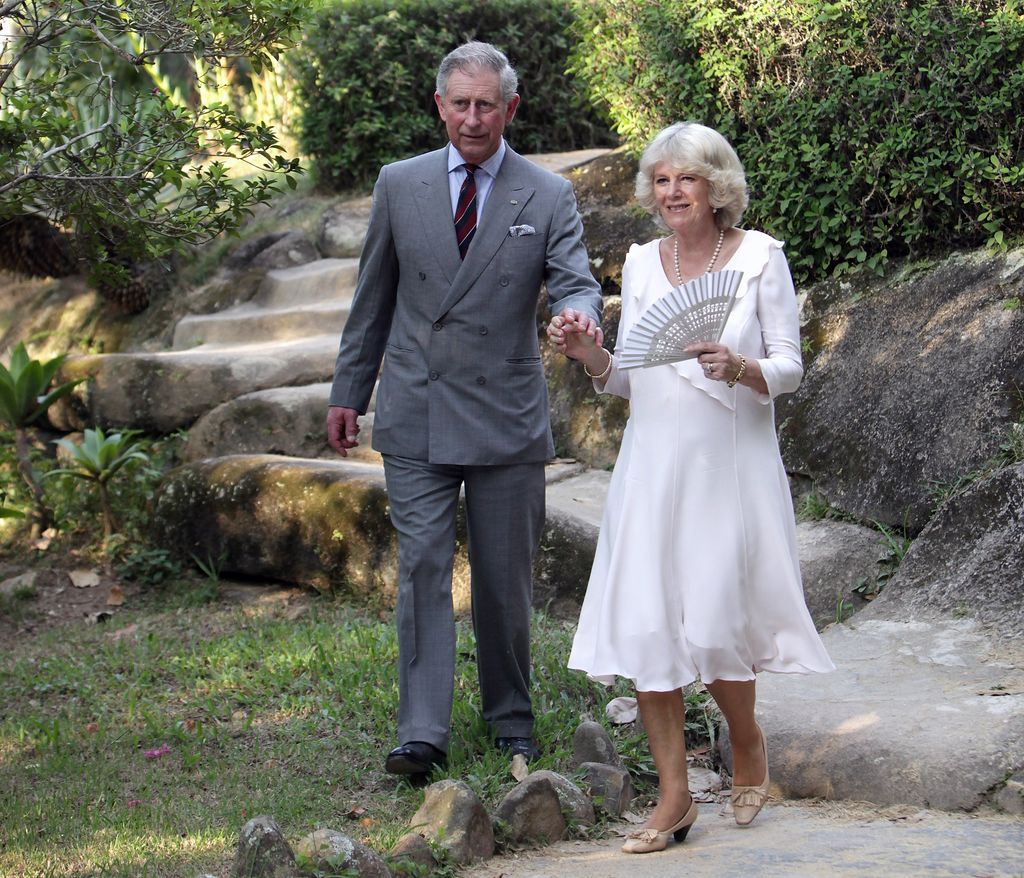 Charles and Camilla walk through botanical gardens in Rio De Janeiro