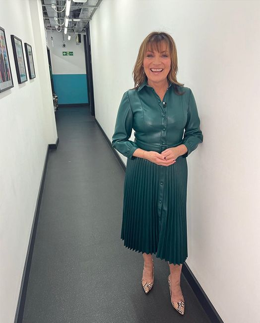 lorraine kelly wearing green leather dress