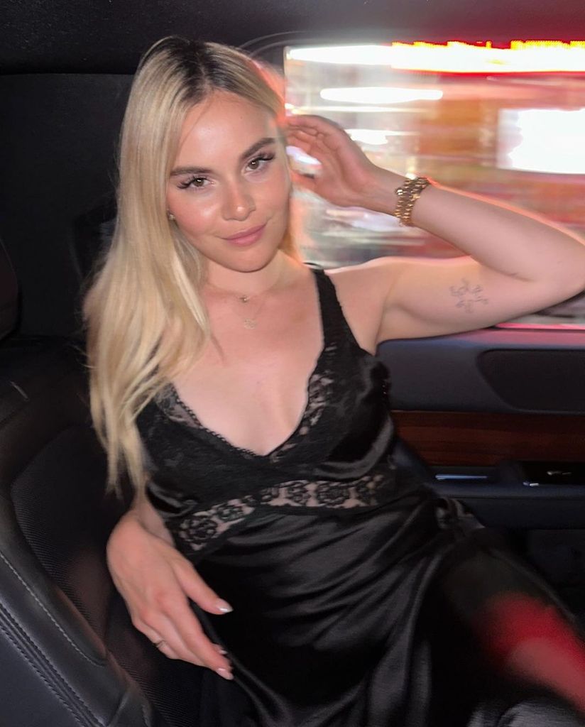 holly ramsay back seat of car in silk dress
