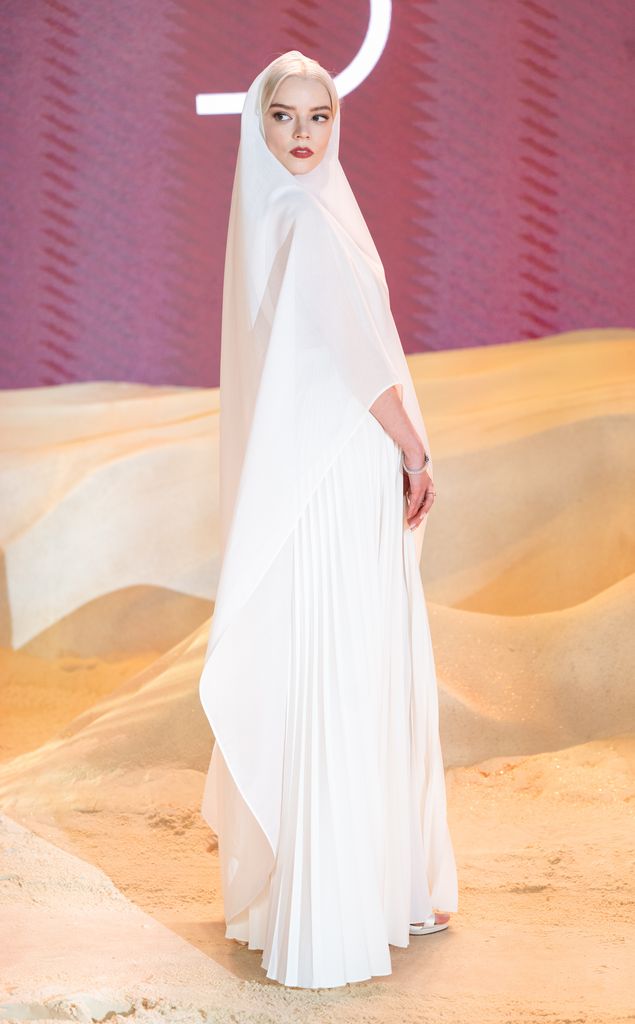 Anya Taylor-Joy attends the World Premiere of "Dune: Part Two" in London's Leicester Square in an all white hooded gown