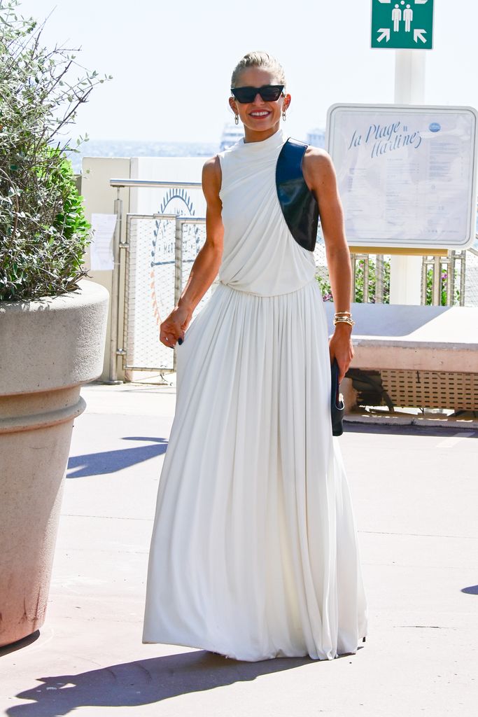 Caroline Daur is seen out and about on May 16, 2024 in Cannes, France in a white summer dress