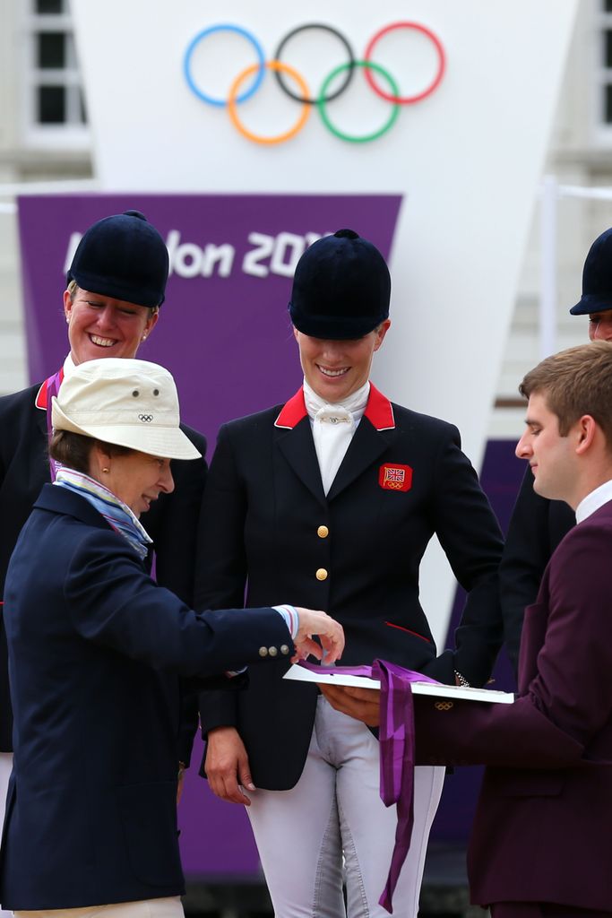  Zara Phillips is presented a silver medal by her mother, Princess Anne, Princess Royal 