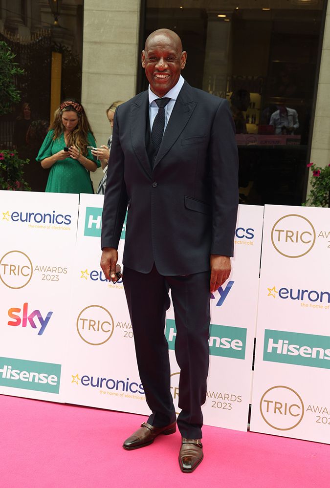 Shaun wallace wearing a black suit at the Tric awards