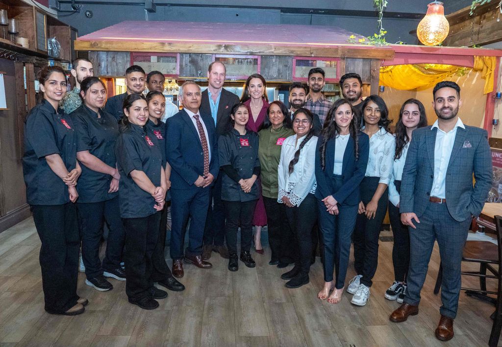 The Prince and Princess with the team at Indian Streatery
