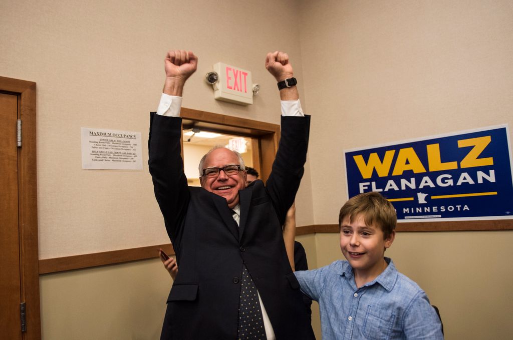 Tim Walz (D-MN) and his son Gus Walz celebrate while entering his election night party on August 14, 2018 in St Paul, Minnesota