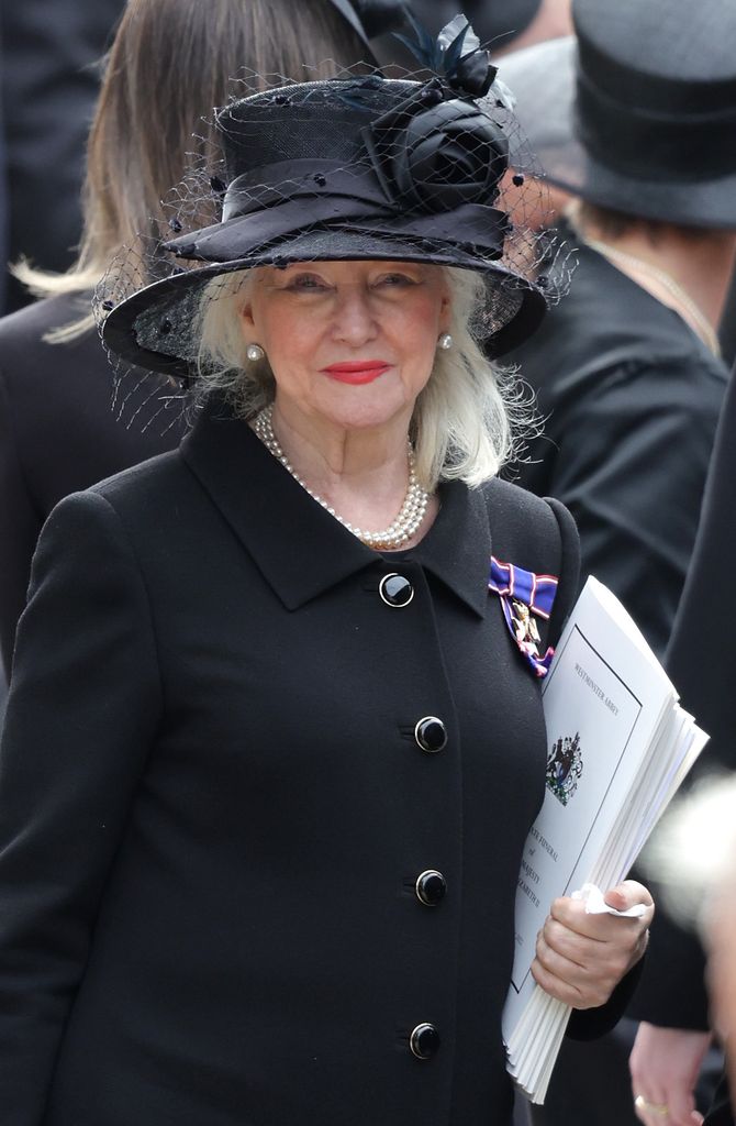 Angela Kelly wearing a black hat and matching clothes to the Queen's funeral
