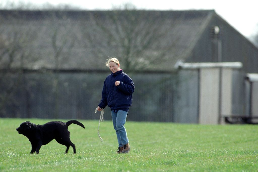 Zara Phillips Walking A Black Labrador Dog During The Gatcombe Park Horse Trials