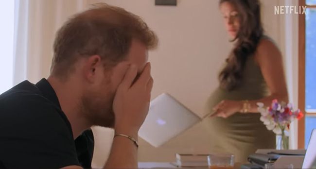 pregnant meghan markle with prince harry with head in hands