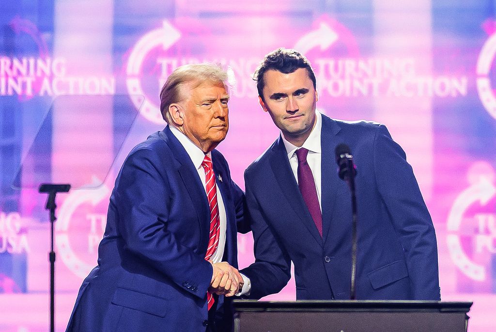 Donald Trump shakes hands with Charlie Kirk