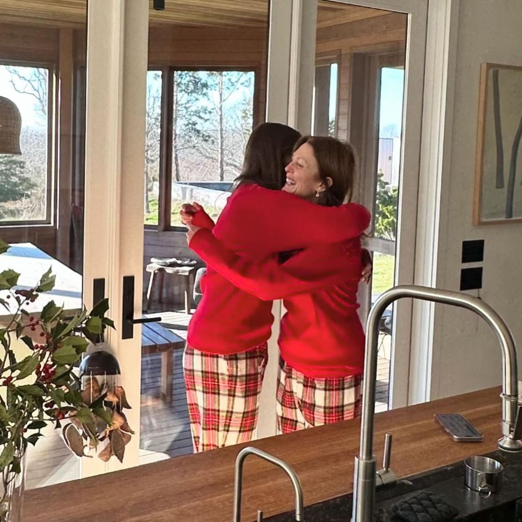 Julianne Moore gives her daughter Liv a hug as they wear matching PJs
