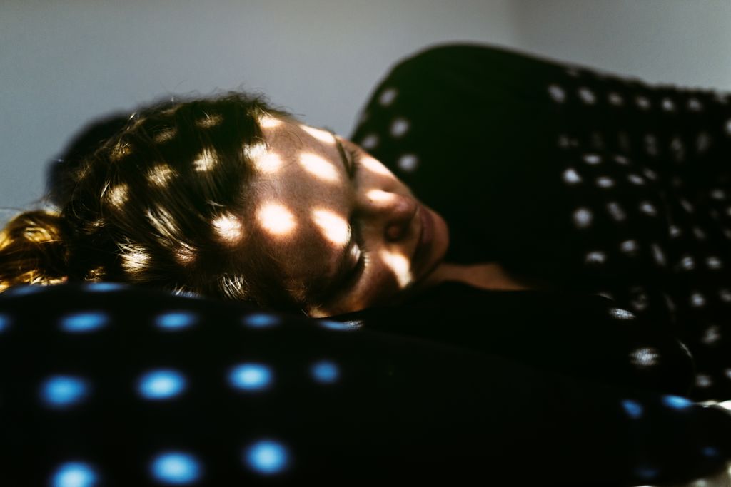 woman lying on the bed at home.