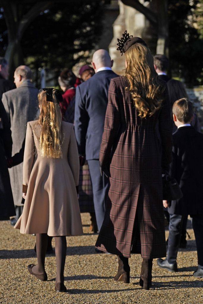 Kate and Charlotte from behind walking into church
