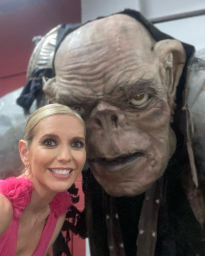 woman taking selfie with troll 