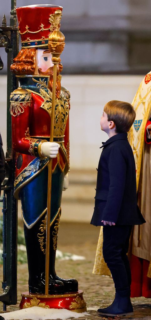 Prince Louise looking at a Nutcracker statue
