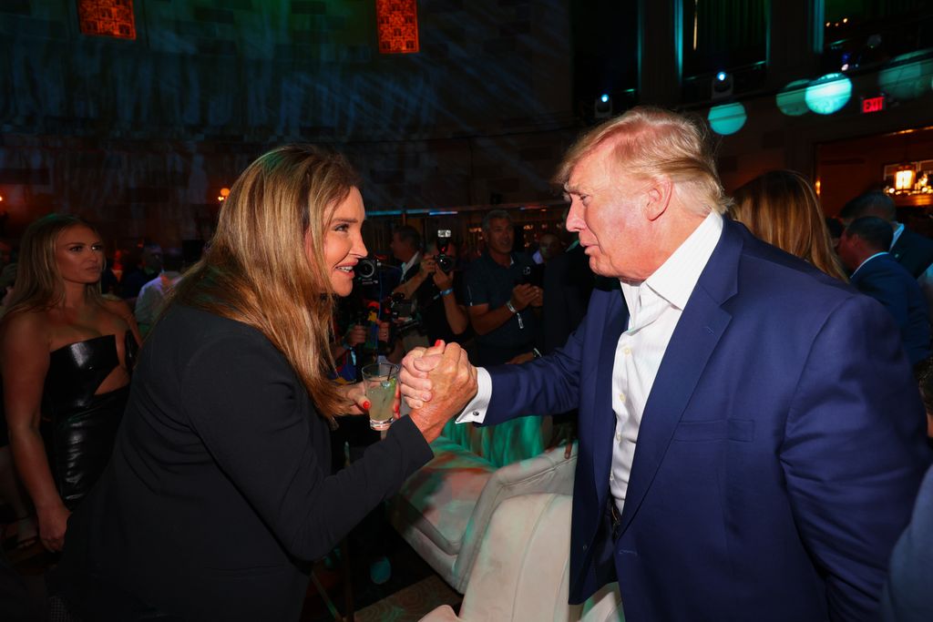 Caitlyn Jenner clutching hands with Donald Trump
