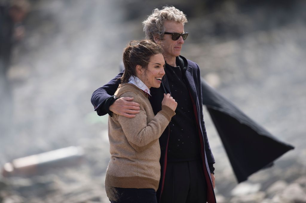 Peter Capaldi with his arm around Ingrid Oliver during filming of Doctor Who