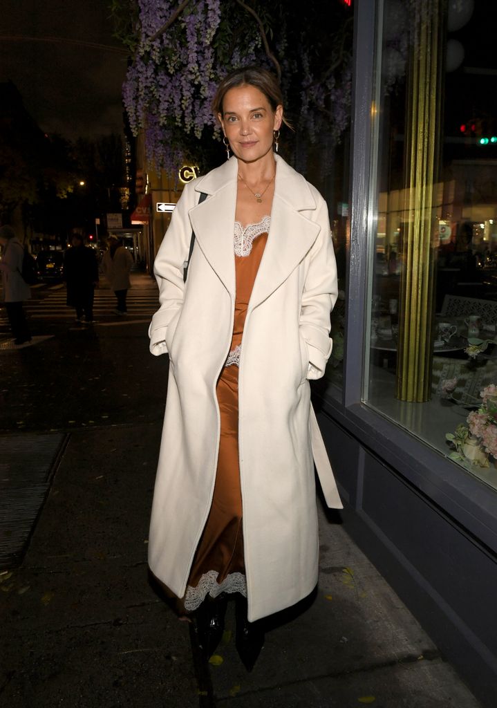 Katie Holmes in ivory coat and silk co-ord