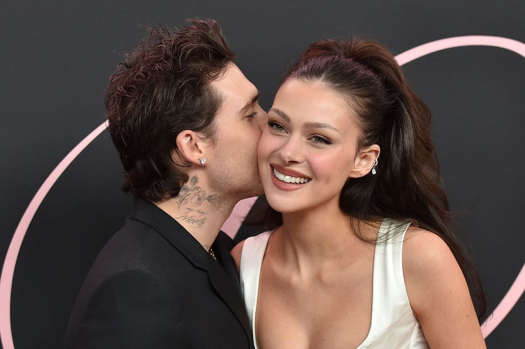 couple kissing at premiere 