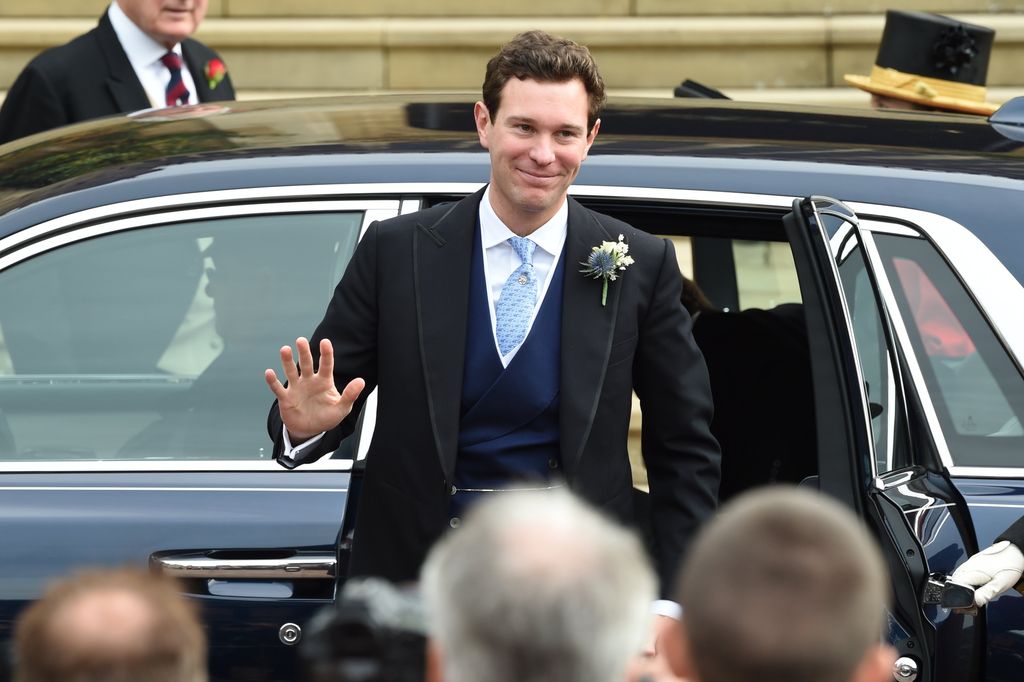 Jack Brooksbank waving as he gets out the car on his wedding day