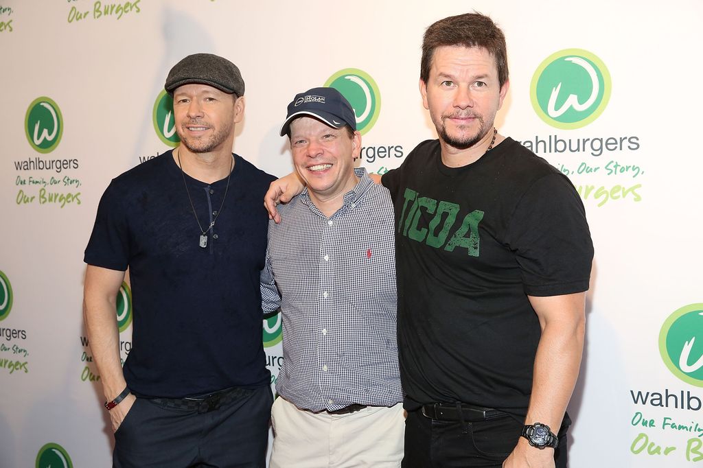 Donnie Wahlberg, Paul Wahlberg and Mark Wahlberg attend the Wahlburgers Coney Island VIP Preview Party at Wahlburgers Coney Island on June 23, 2015 in New York City