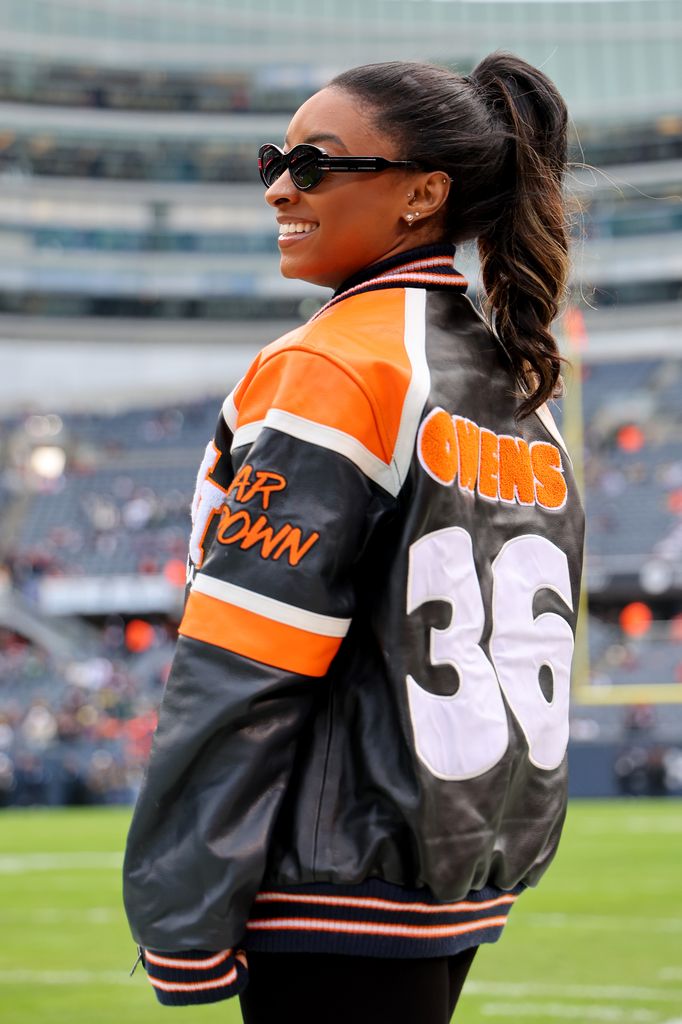 Simone Biles looks on prior to a game between the Chicago Bears and the Green Bay Packers