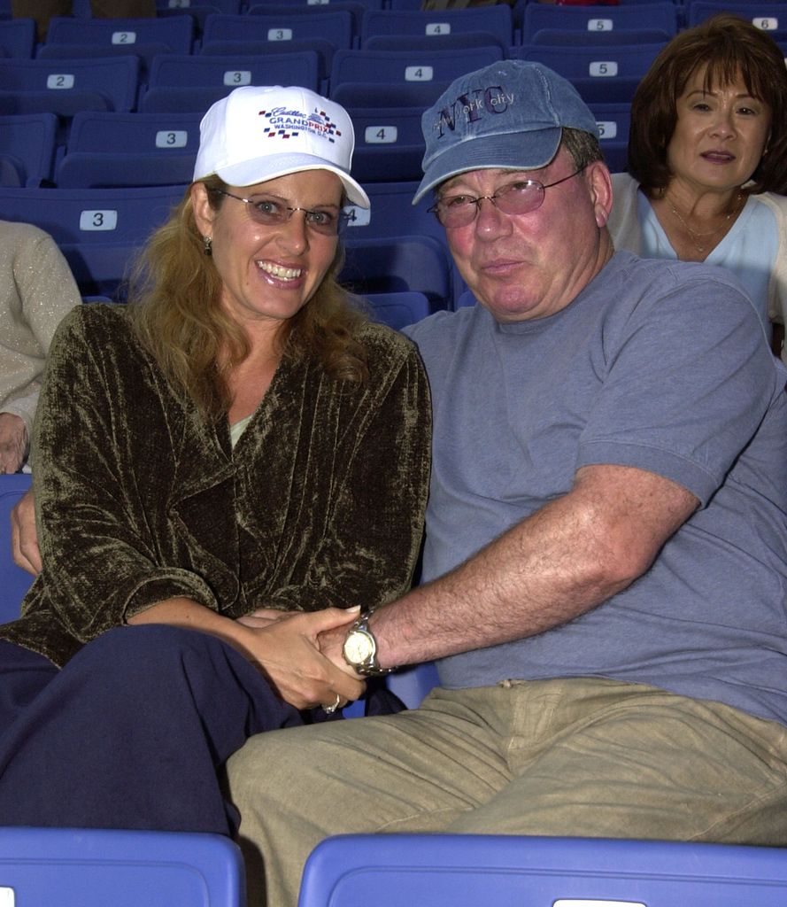 William holds hands with third wife happy baseball game