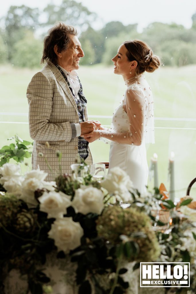 Faye Harris holding hands with Ronnie Wood on her wedding day