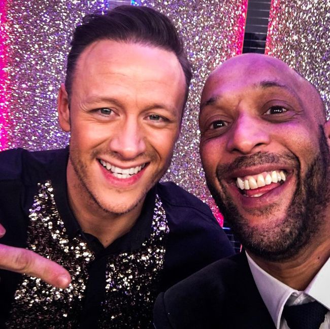 kevin and tommy pose for a photo on the strictly come dancing set