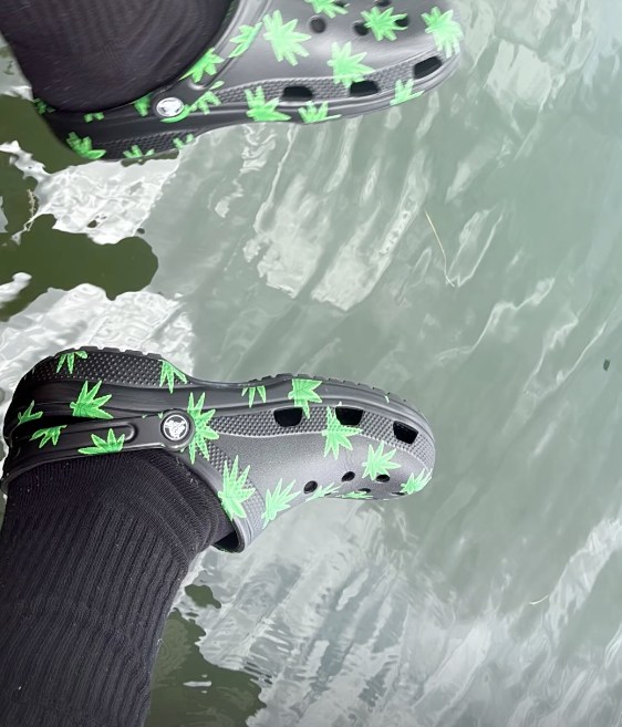 cruz beckham wearing hemp-dotted Crocs while in Miami
