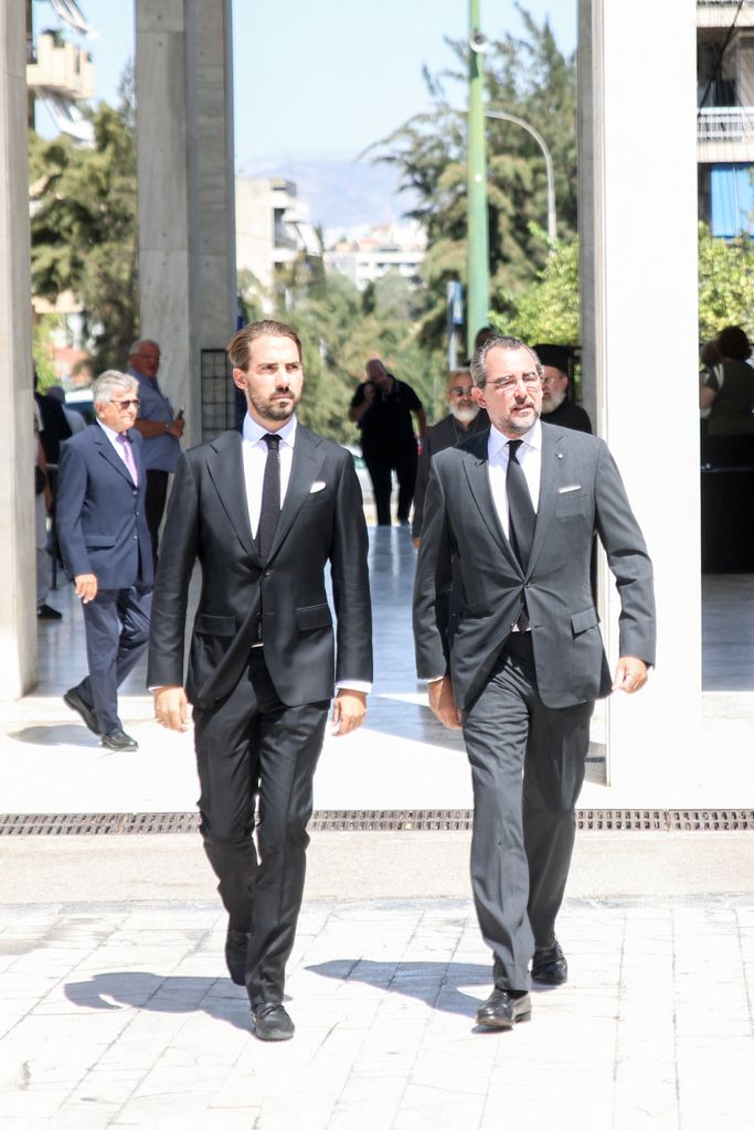 Prince Philippos and Prince Nikolaos in suits