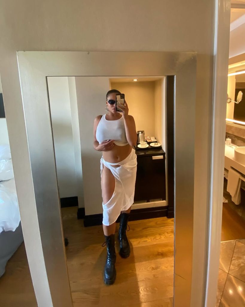 Alva Claire in white skirt