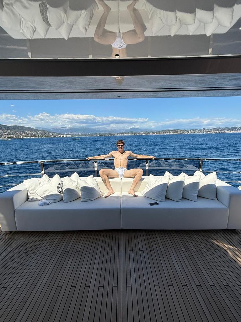 cruz beckham poses on the family superyacht