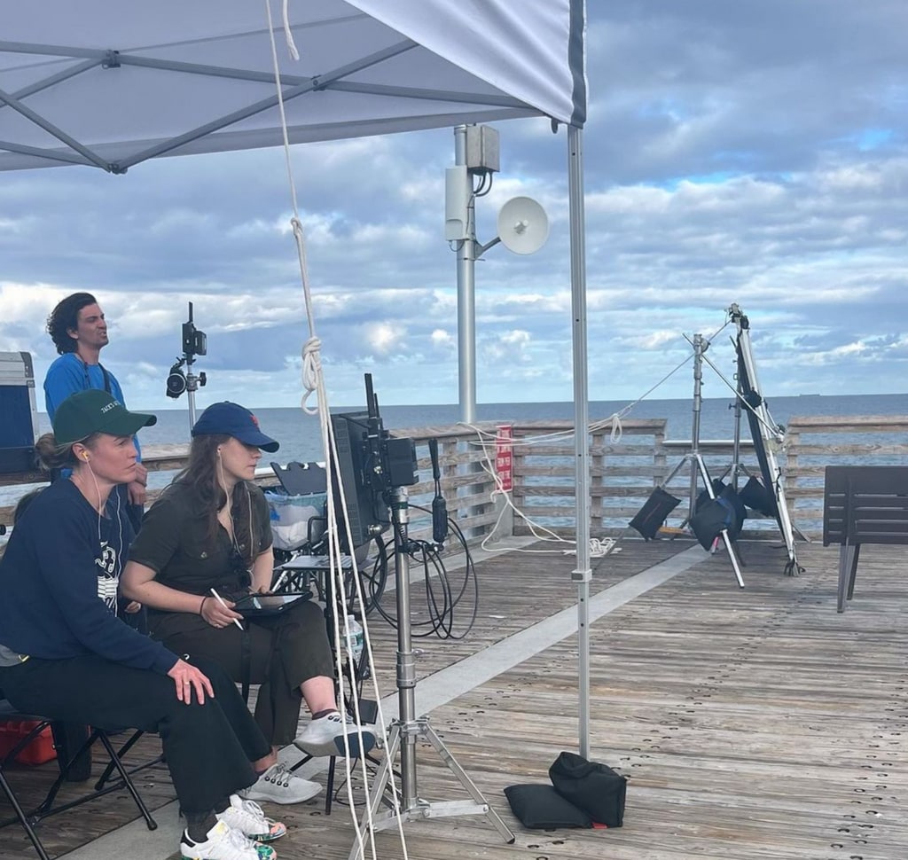 Photo shared by Julia Stiles on Instagram March 2024, a behind-the-scenes shot on set of her directorial debut, wish you were here.