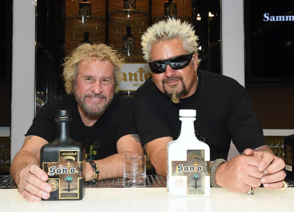 Sammy Hagar and Guy Fieri pose during the announcement of their partnership with Los Santo and Santo Puro Mezquila, in addition to the launch of Santo Fino Tequila at Southern Glazer's Wine & Spirits of Nevada on April 4, 2019 in Las Vegas, Nevada