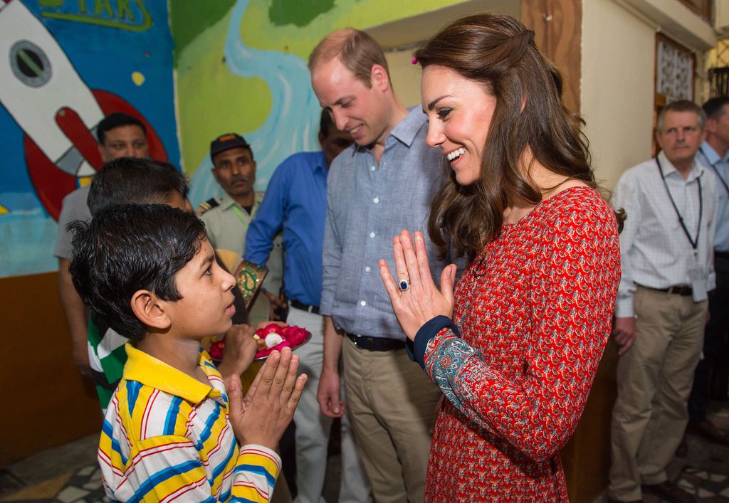 William and Kate greeting children in New Delhi