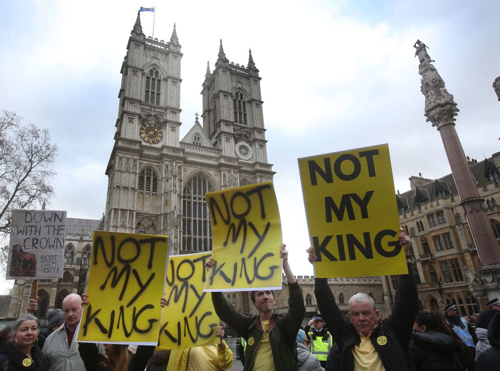 Protesters from Republic hold up signs saying Not My King outside Westminster Abbey 