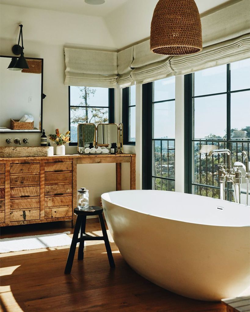 Julianne's bathroom with a free-standing tub and warehouse-style windows