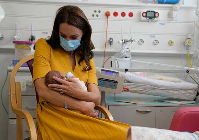 kate middleton cradles newborn