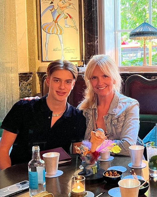 penny lancaster at restaurant table with teenage son alastair