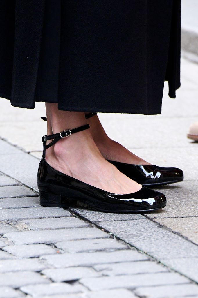 A close up of Queen Letizia of Spain's patent ballet flat shoes