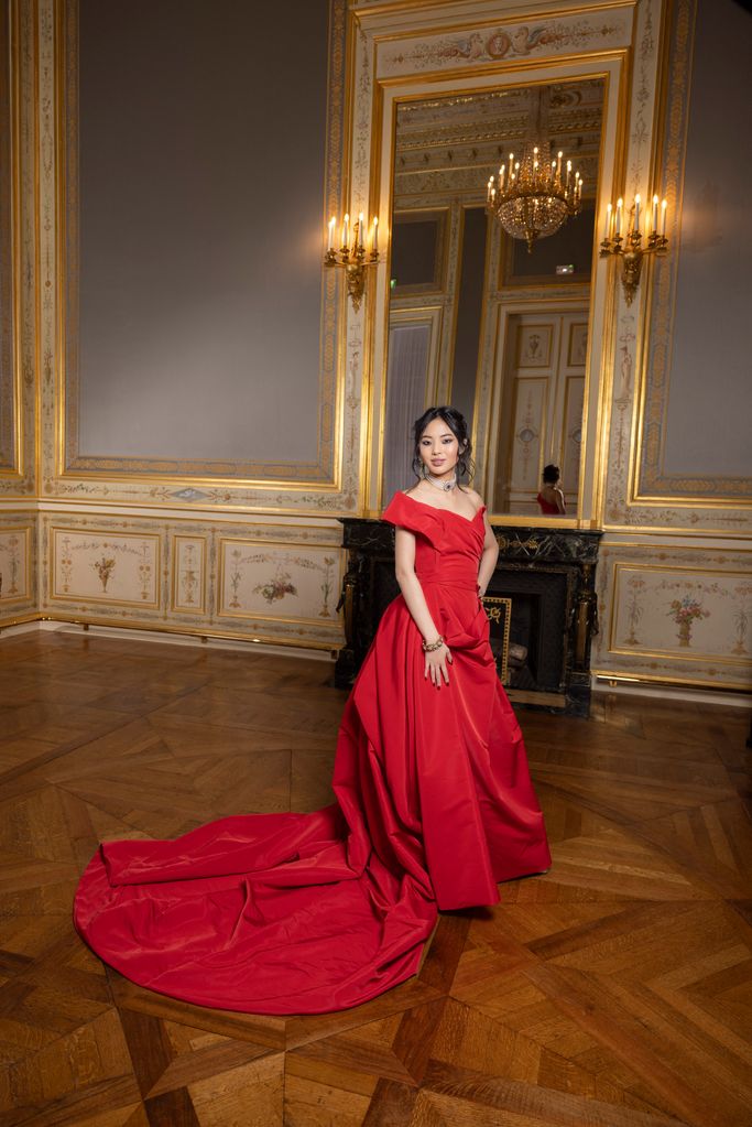 Skye Wong wears a red dress by Vivienne Westwood