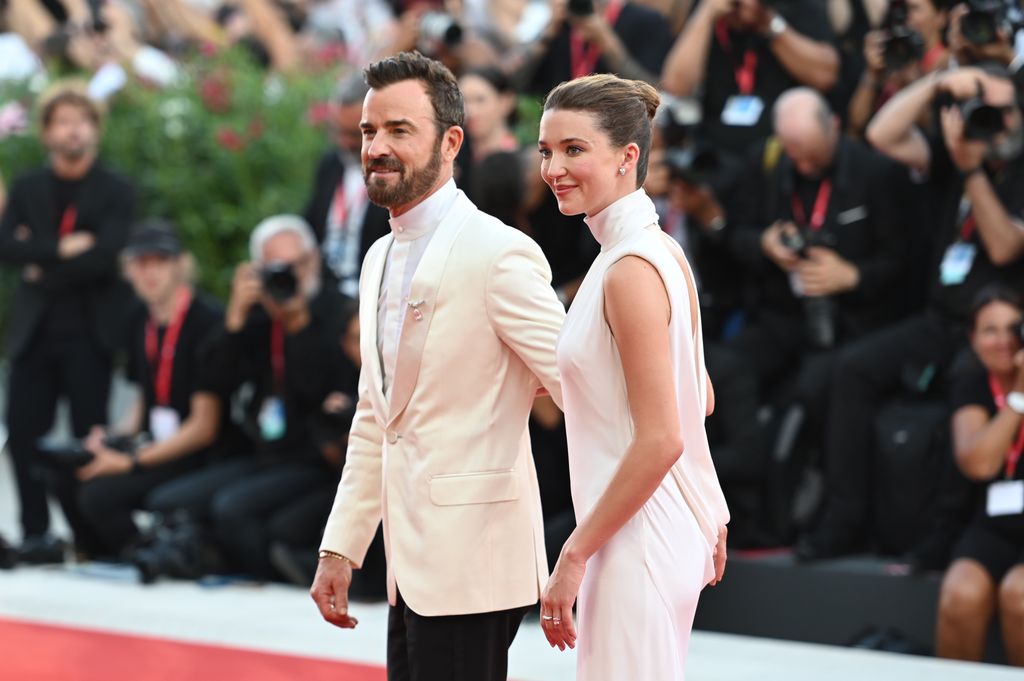 Justin and Nicole held hands tightly as they took to the red carpet in Venice