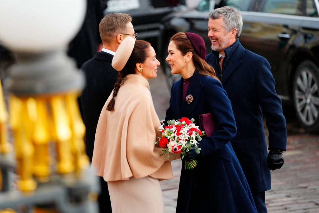 President of the Republic of Finland Alexander Stubb (L) and his spouse Suzanne Innes-Stubb (2nd L) welcome King Frederik X of Denmark (R) and Queen Mary of Denmark 