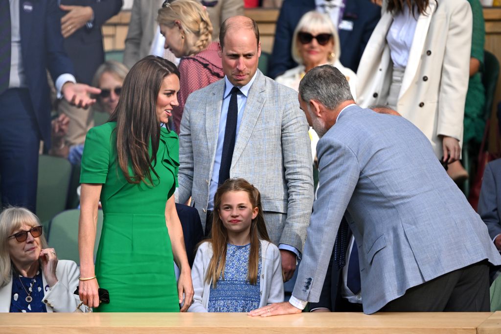 King Felipe speaking to Princess Kate and Princess Charlotte at Wimbledon