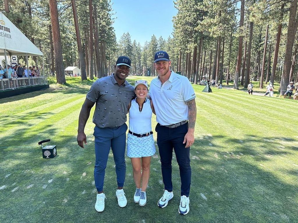 Dylan Dreyer looked tiny as she posed with two athletes on the golf course