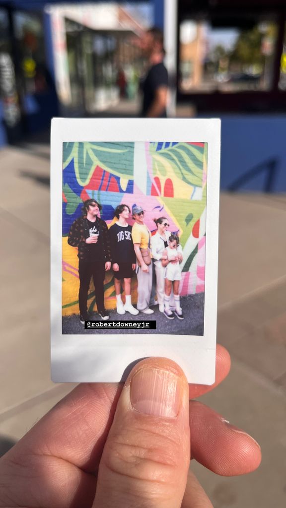 Robert Downey Jr. and his wife Susan Downey in a polaroid photo with Indio Downey and their children Avri and Exton, shared on Instagram by Indio