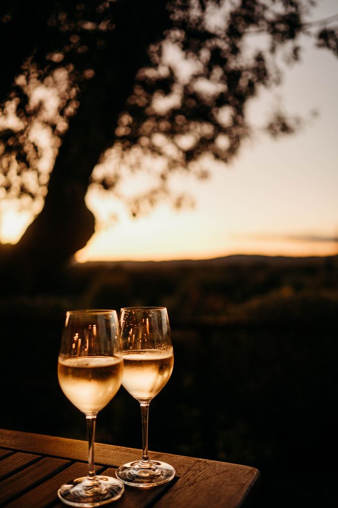 Two glasses of prosecco whilst watching the sunset in Tuscany