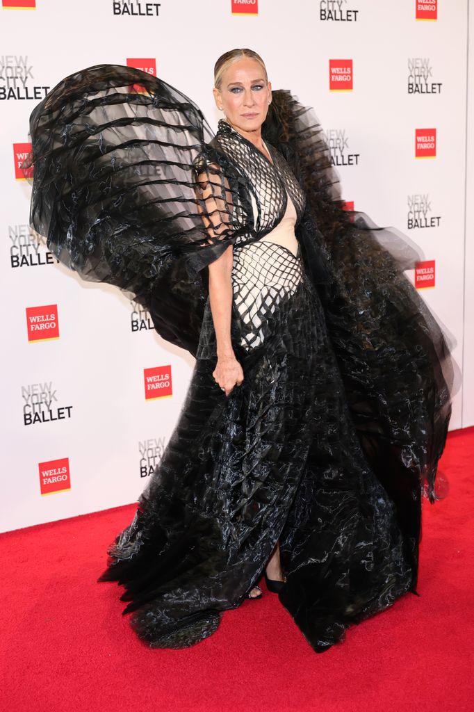 Sarah Jessica Parker on red carpet in black dress with wings