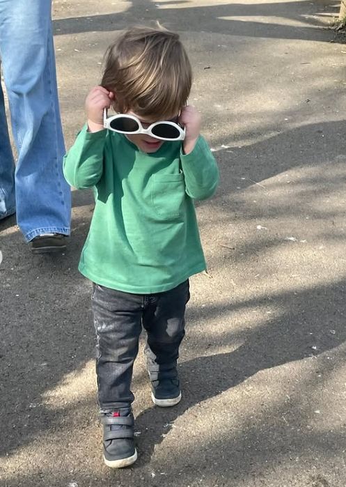 Ernest Brooksbank walking with a pair of upside down sunglasses